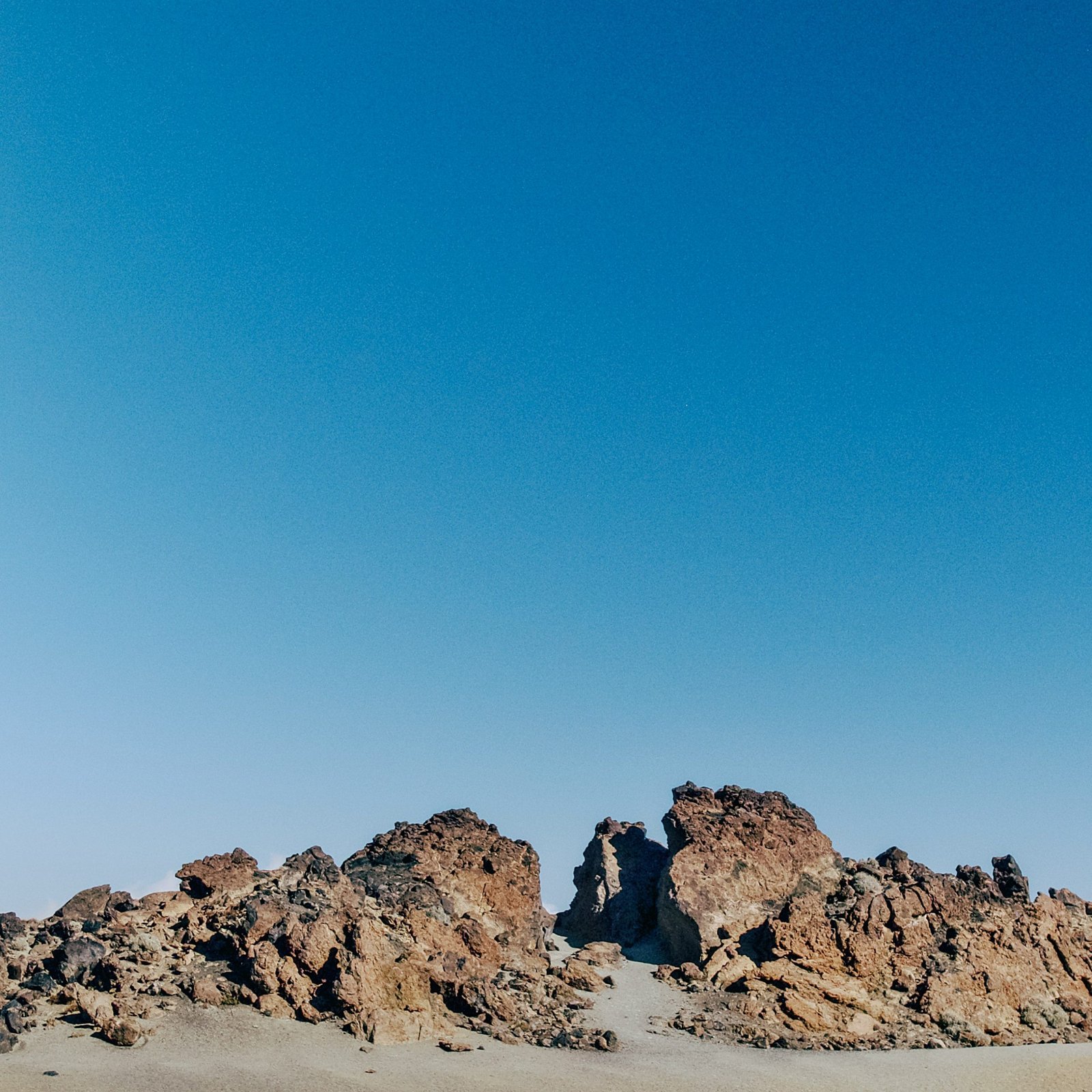 a large rock formation in the middle of a desert