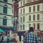 a man and a woman walking down a street