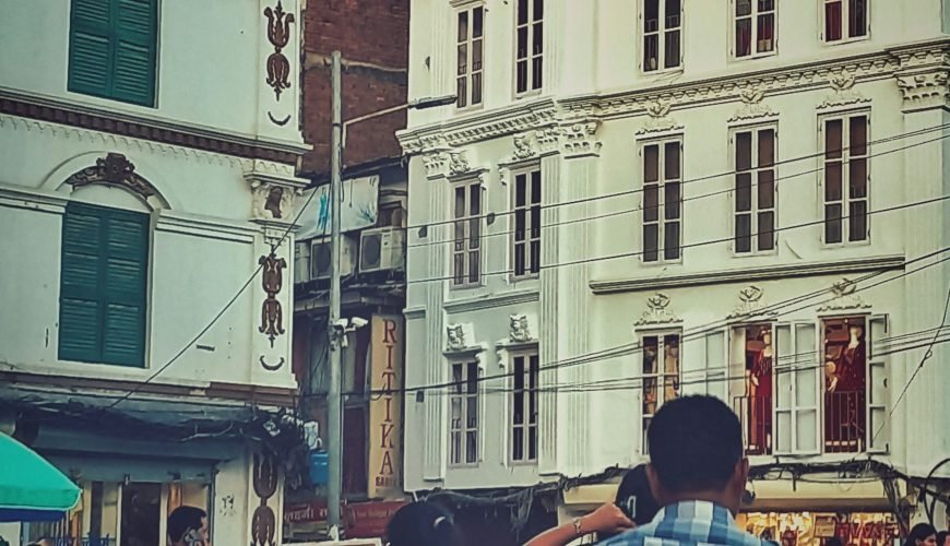 a man and a woman walking down a street